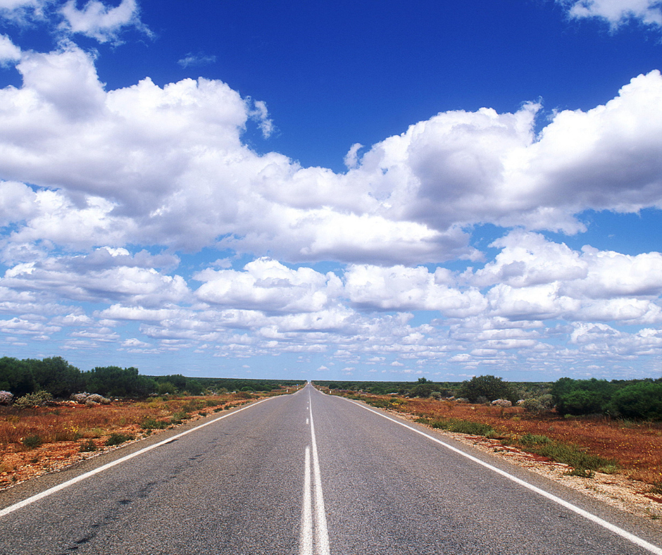 Open road with blue skies and clouds
